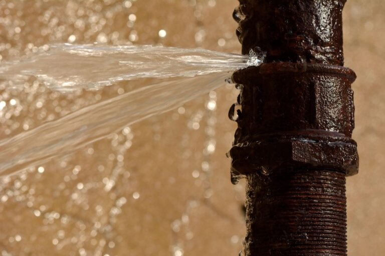 Old plumbing pipes in Long Beach, CA. Image of leaking old pipe.